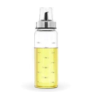amazon brand - solimo oil pourer with leak-proof and spill-proof plastic closure and measurements microwave-safe freezer-safe and dishwasher-safe borosilicate glass 300 ml
