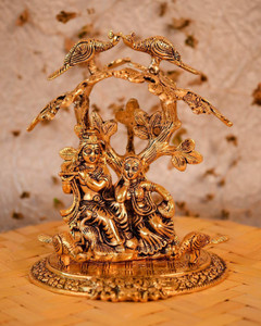 chhariya crafts metal radha krishna sitting under tree plying flute decorative showpiece  -  24 cm