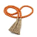 CVHOMEDECO. Wood Beads Garland with Tassels Farmhouse Rustic Wooden Prayer Bead String Wall Hanging Accent for Home Festival Decor. Orange