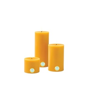 first row aromatic fables bosco pond scented yellow color pillar wax candles with fiber tray stand size 4x3x2 inch set of 3