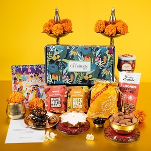 gladful glow amp goodness 7 item diwali gift box  dry fruit burfi almonds mukhwaas diya with holder greeting card amp festive potli