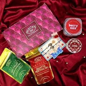 healthy treat bhaiya bhabhi twilight treats rakhi gift hamper  bhaiya bhabhi rakhi set of 2 amp roli chawal  bhaiya bhabhi rakhi set with healthy snacks for rakshabandhan gift hamper  roasted roasted snacks and rakhi for brother and lumba rakhi