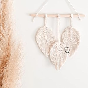 macrame kn0ts macrame wall hanging leaf tapestry  handmade boho feather wall decor with wooden dowel  aesthetic woven art for bedroom living room and nursery off- white