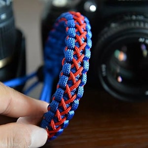 rubric braided cobra paracord hand grip wrist strap for all dslr camerabinoculars blue and orange twist