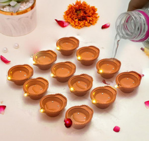 zuru bunch 12 pcs led tea light water sensor diya plastic pack of 12 table diya set height 15 inch
